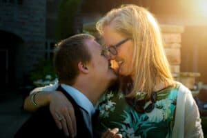 Mom with blond hair hugging son with downs syndrome